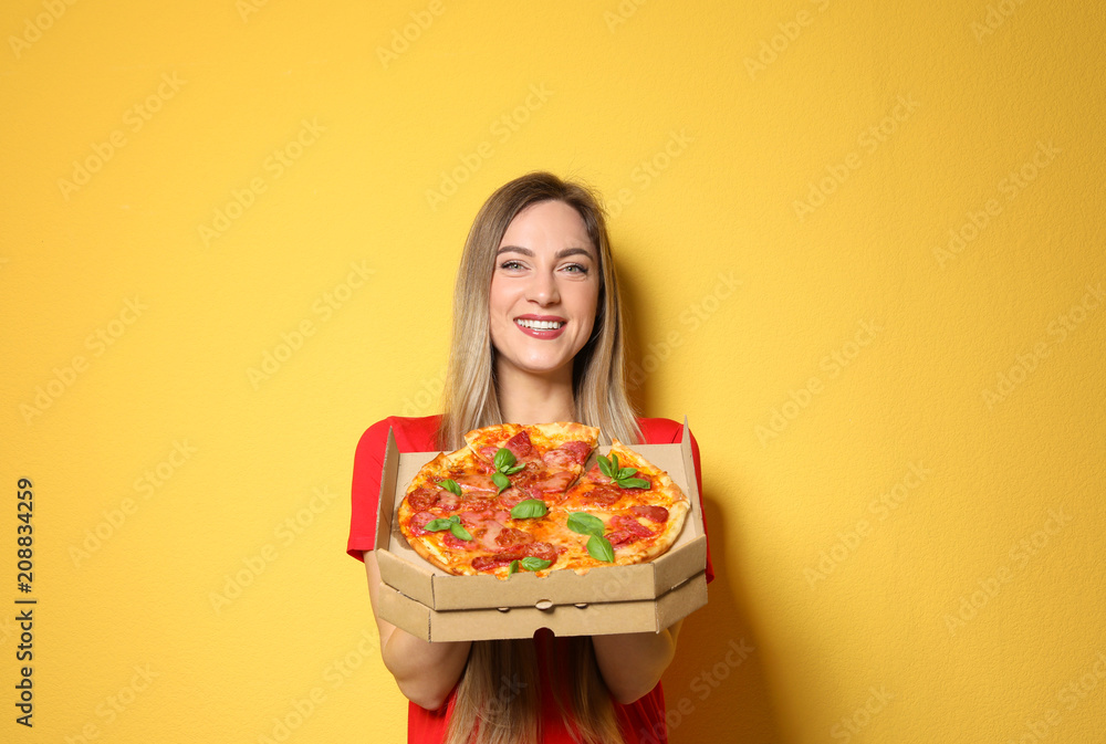Attractive young woman with delicious pizza on color background Attractive young woman with delicious pizza on color background