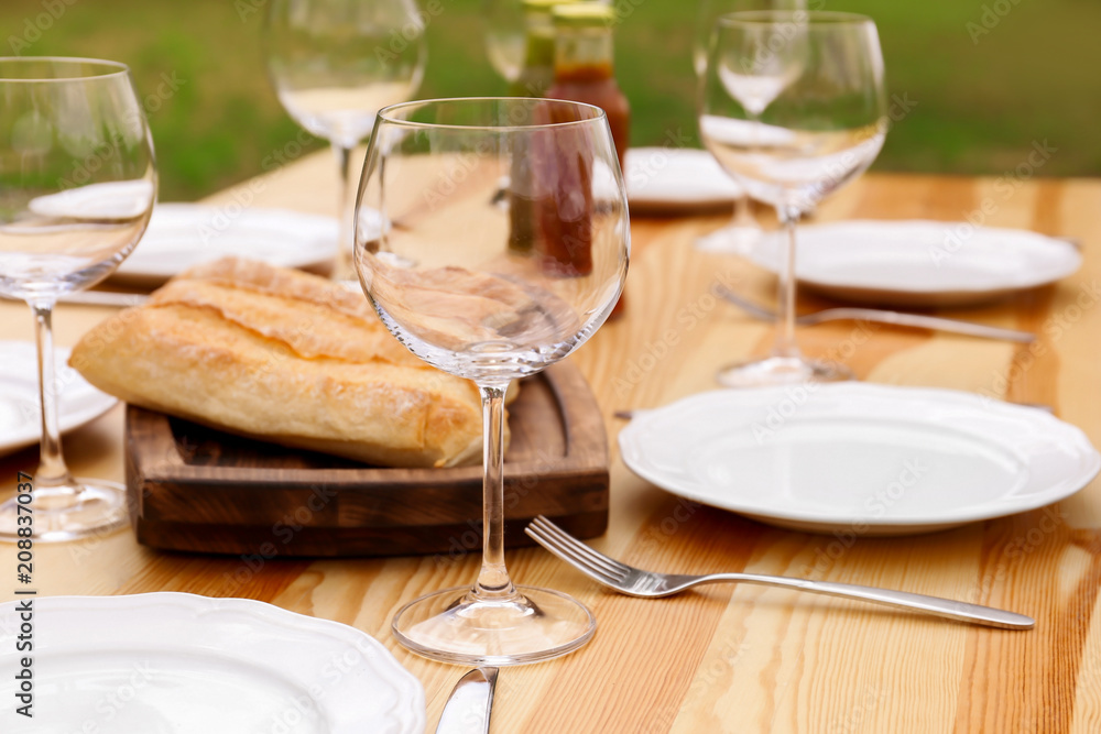 Set of dishware on table outdoors. Summer picnic