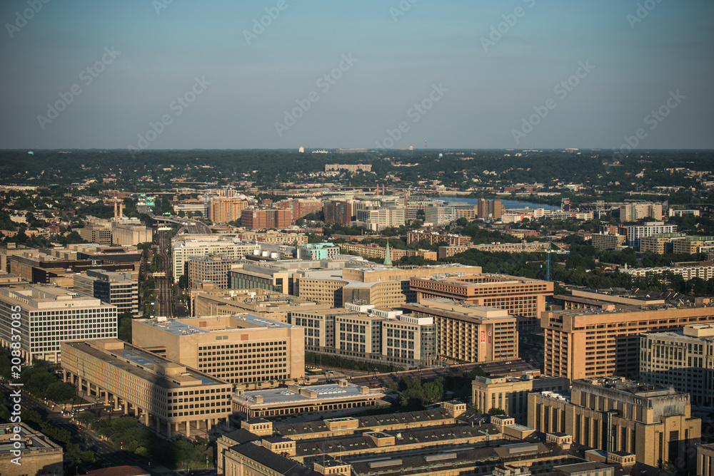 Aerial view (above) of Downtown Washington, DC from National Monument.  Sunset evening time.