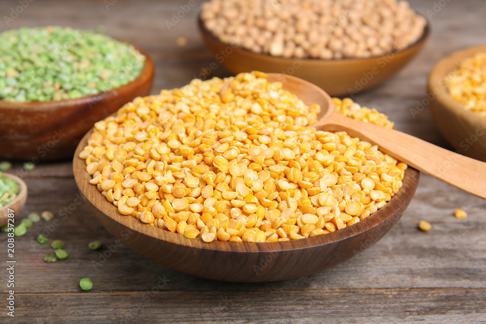 Bowl with dried peas on wooden table Bowl with dried peas on wooden table