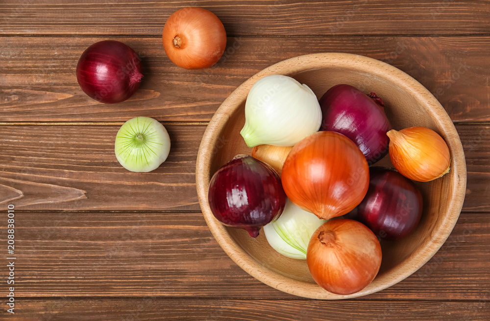 Flat lay composition with fresh onions on wooden background Flat lay composition with fresh onions on wooden background
