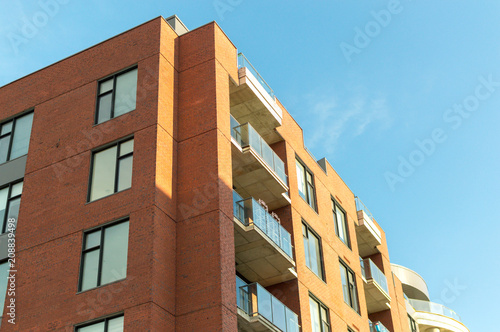 Modern condo buildings with huge windows and balconies in Montreal, Canada. 