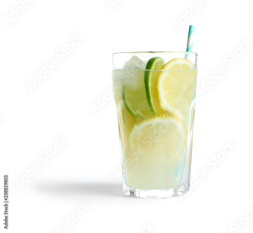 Glass of natural lemonade with citrus fruits on white background