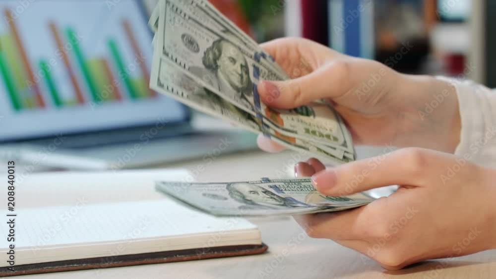 Woman hand counting money cash in office. Cash credit in dollar currency. Close up of business woman counting dollar bills. Female hands count money at office workplace
