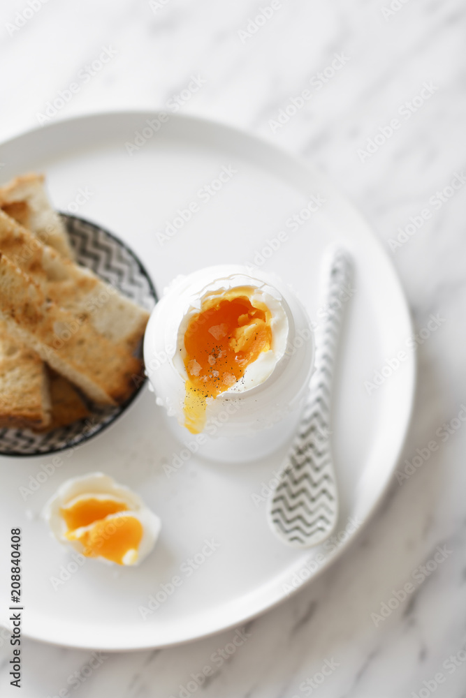 A soft-boiled egg with toast soldiers. A soft-boiled egg with toast soldiers.