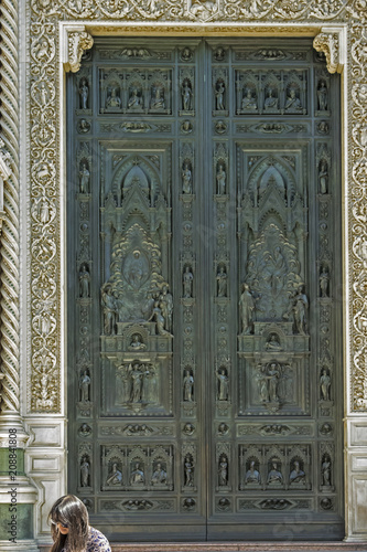The ornate bronze door of the Basilica di Santa Maria del Fiore, Florence, Italy