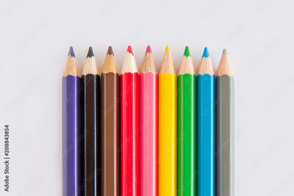Group of graphite and color pencil, green rubber on white background with space copy Group of graphite and color pencil, green rubber on white background with space copy