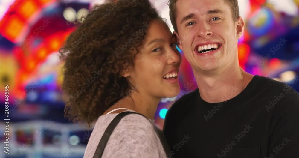 Close up of cheerful couple at carnival, smiling at camera, Portrait of Caucasian male and female having fun at county fair, 4k Close up of cheerful couple at carnival, smiling at camera, Portrait of Caucasian male and female having fun at county fair, 4k