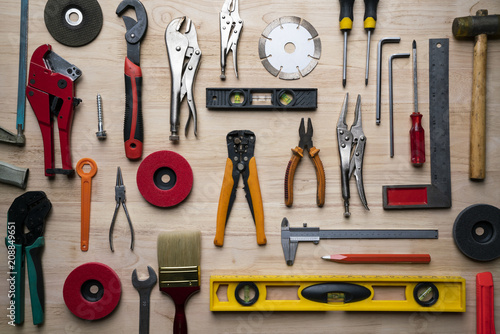 Old tools equipment set on wood table background, engineering and industry tool concept, flat lay photo