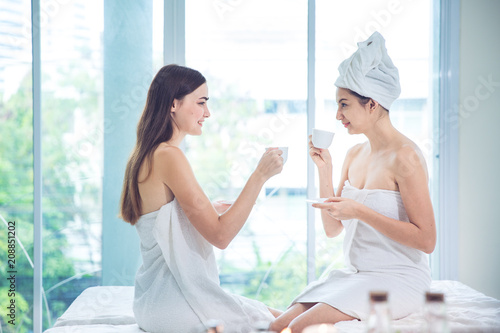 Leisure background, Beautiful girls take a tea break and smile relaxing. Caucasian is feeling good posture in luxury spa, Concept Health and Beauty Background.