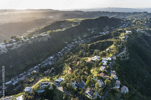 Aerial view of South Beverly Park hilltop homes in the Santa Monica Mountains above Beverly Hills and Los Angeles, California.   photo
