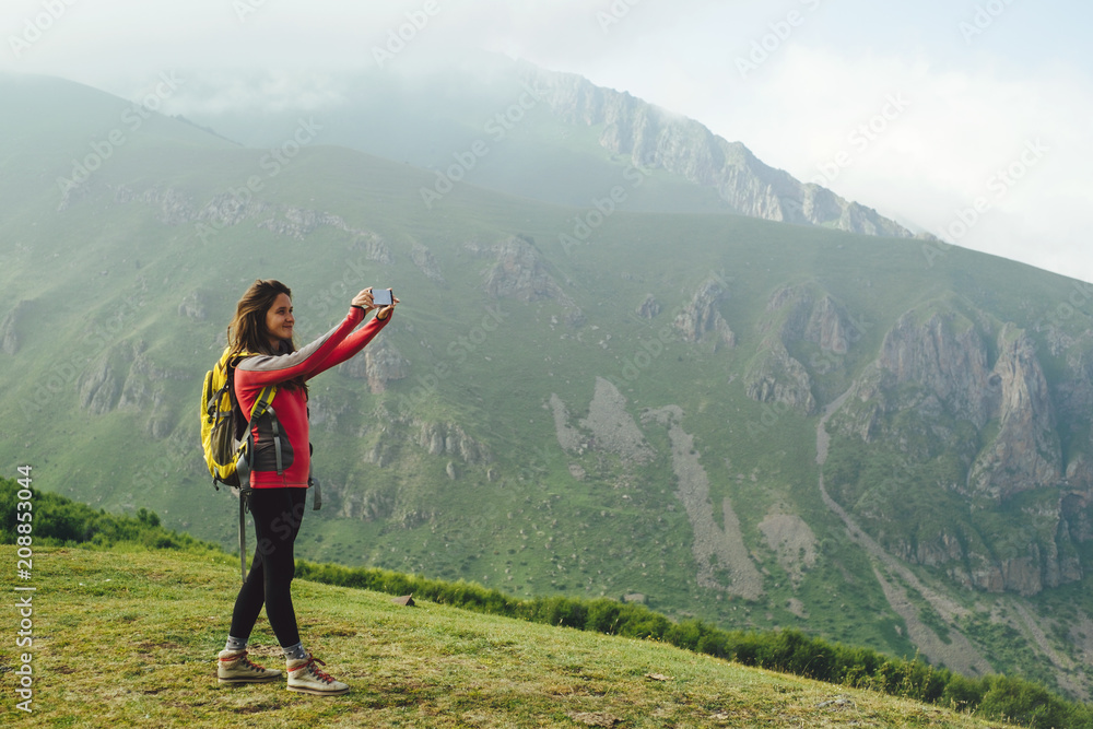 Young woman hiking in the mountains Young woman hiking in the mountains