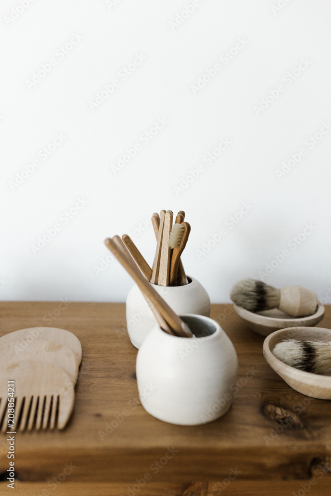 wood shelf with organized brushes and wooden combs in curated shop wood shelf with organized brushes and wooden combs in curated shop