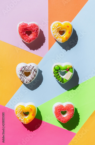 Various kinds of colorful pastry/cakes/donuts.