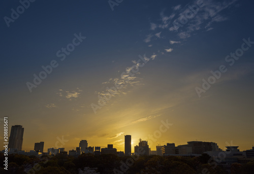 silhouette of Osaka city skyline under sunset