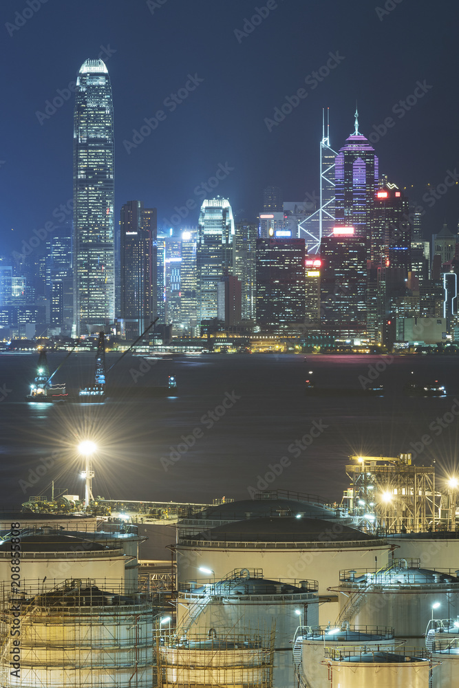 Oil tank in Victoria harbor of Hong Kong city at night