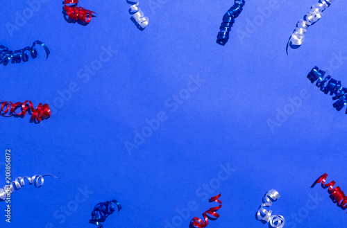 USA holiday decorations on a blue background flat lay