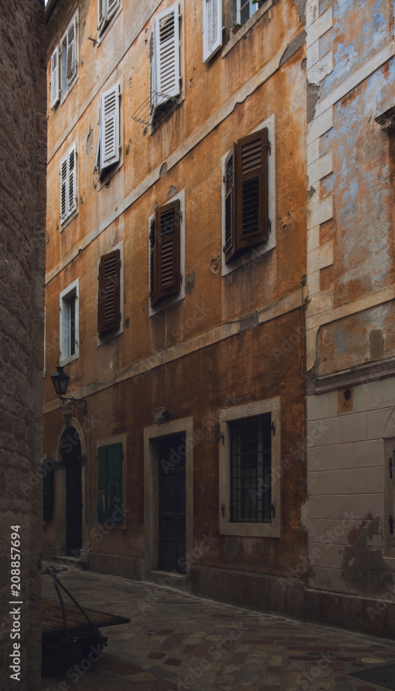 Narrow street with yellow facade in old town of Kotor. Narrow street with yellow facade in old town of Kotor.