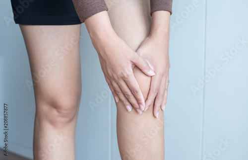 Woman having knee pain,Female feeling exhausted and painful,Close up