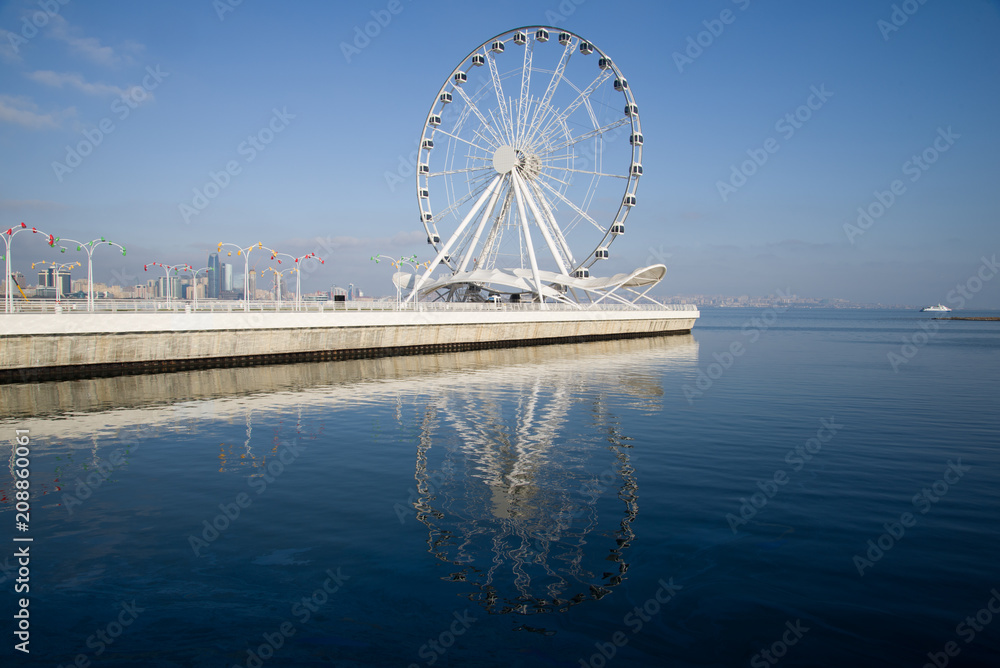 View of the Ferris wheel on the Caspian Sea embankment on a sunny December day. Baku, Azerbaijan
