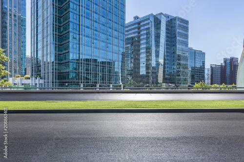 Canvas Print Panoramic skyline and modern business office buildings with empty road,empty con
