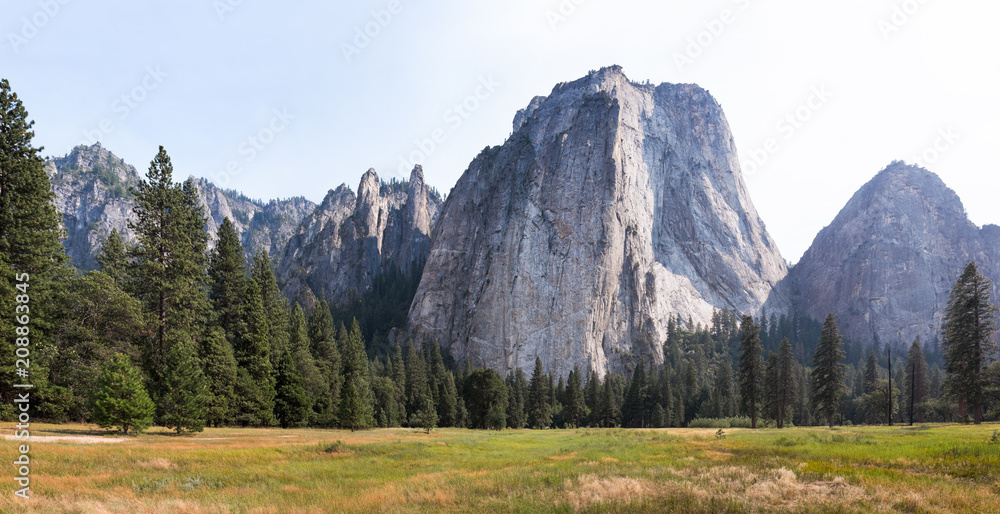 Yosemite valley panorama with plains and mountains on a sunny day