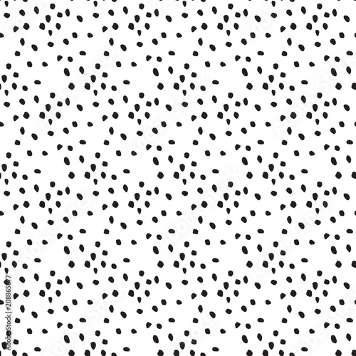 Hand drawn dots seamless vector pattern. Messy small spots black and white background.