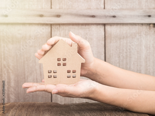 Mortgage concept by house from in hand