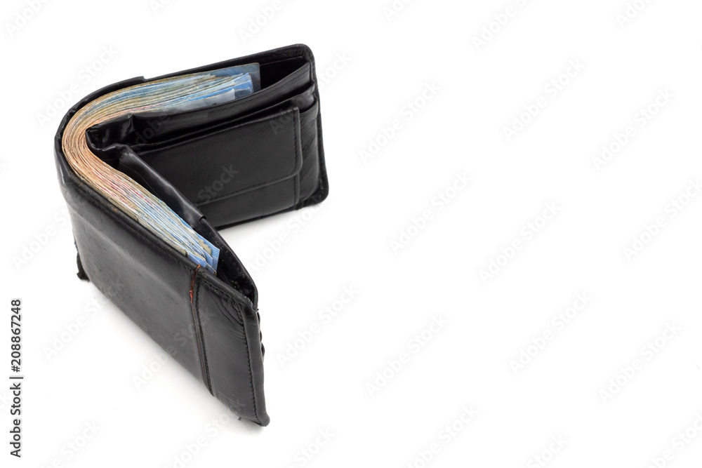 Many banknotes in black wallet on white background. copy space Many banknotes in black wallet on white background. copy space
