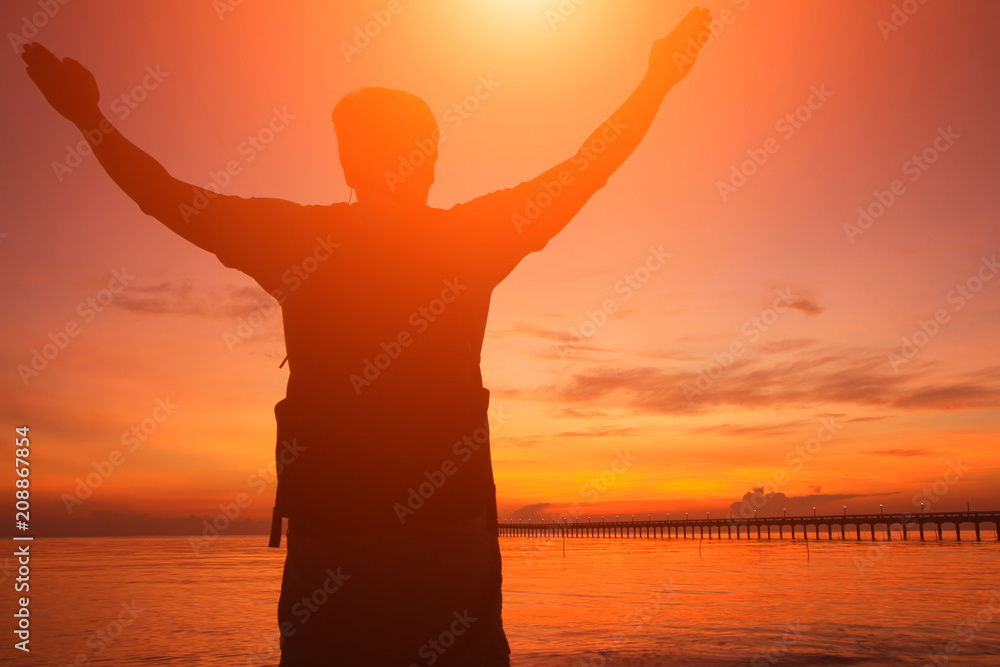 Silhouette of a man  in the beautiful sunrise.