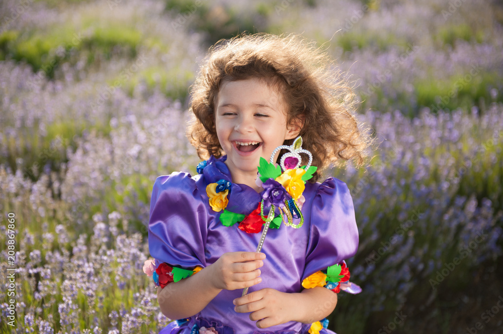 happy delightful beautiful little girl in fairy dress and magic wand in hand happy delightful beautiful little girl in fairy dress and magic wand in hand