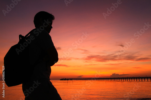 Silhouette of a man in the beautiful sunrise.