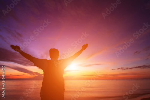 Silhouette of a man in the beautiful sunrise.