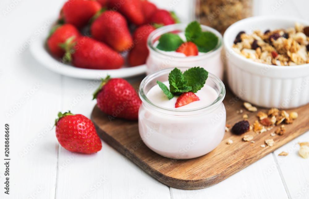 healthy breakfast, yogurt, fresh strawberries and granola healthy breakfast, yogurt, fresh strawberries and granola