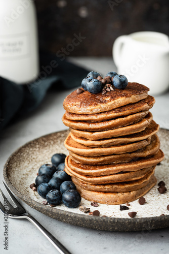 Pancakes with buckwheat and oat flour. Healthy vegan pancakes. Chocolate pancakes