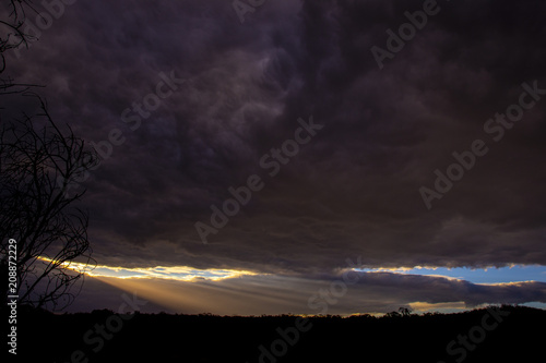 Last rays of sunlight over paddocks and fields on a chilly winters evening in Stanthorpe, Queensland, Australia