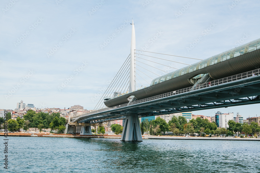Fototapeta premium Part of the bridge in Istanbul connecting the Asian part with the European part of the city. The architecture of Istanbul is on the background