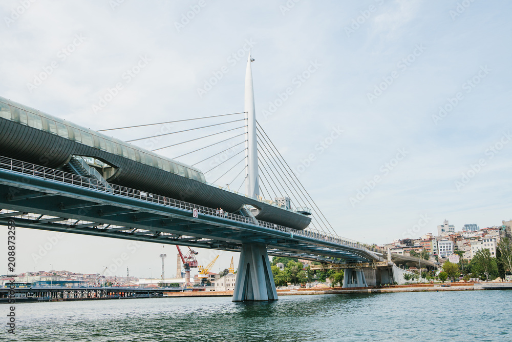 Fototapeta premium Part of the bridge in Istanbul connecting the Asian part with the European part of the city. The architecture of Istanbul is on the background