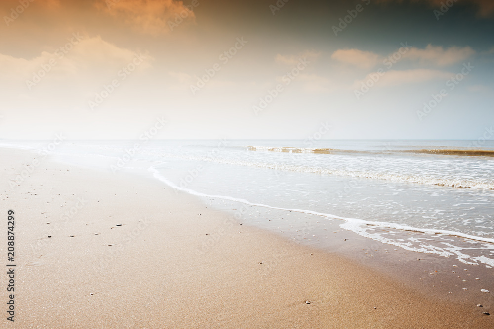 Sandy beach at sunset. Beautiful nature background