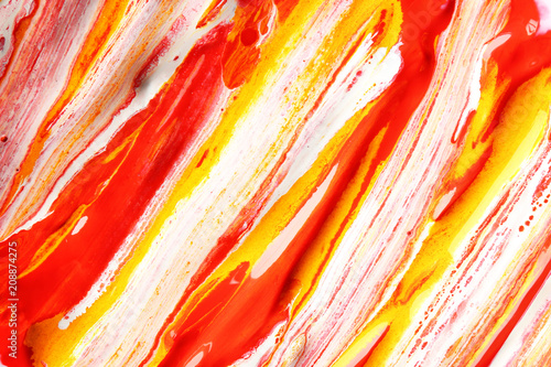Paint swirls with red, yell...