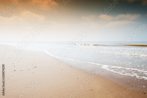 Sandy beach at sunset. Beautiful nature background