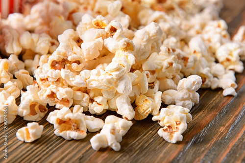 Tasty popcorn on wooden table