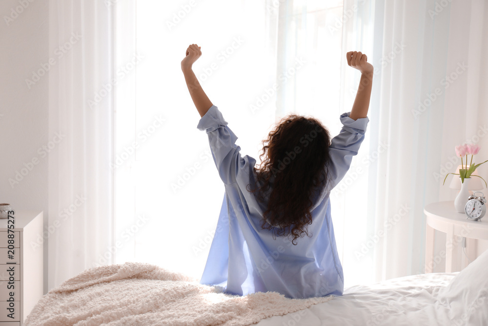 Morning of beautiful young woman in bedroom Morning of beautiful young woman in bedroom