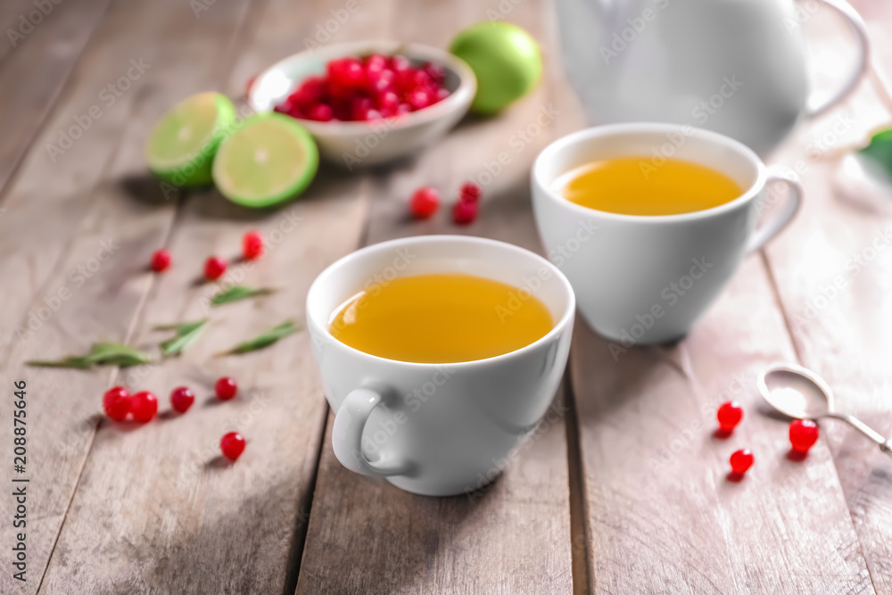 Tea set with hot beverage on wooden table Tea set with hot beverage on wooden table