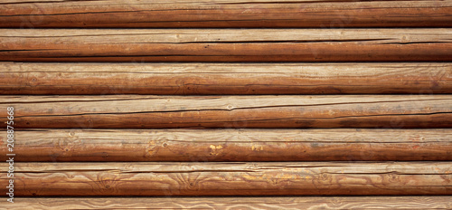 Logs on the wall with a log frame as a background
