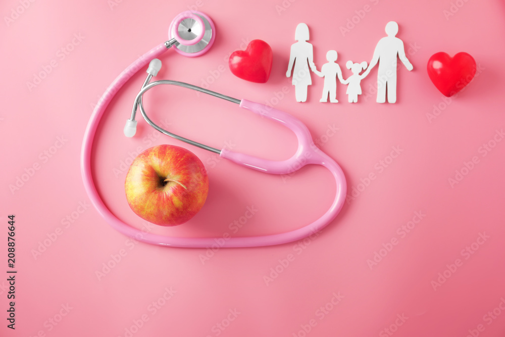 Family figure, apple and stethoscope on color background. Health care concept