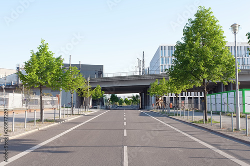 Train bridge across an empty street on a sunny afternoon, in downtown Berlin
