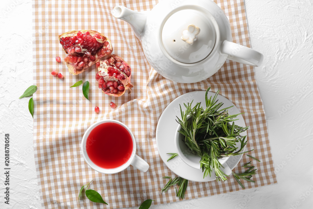 Composition with cup of hot aromatic tea on table Composition with cup of hot aromatic tea on table