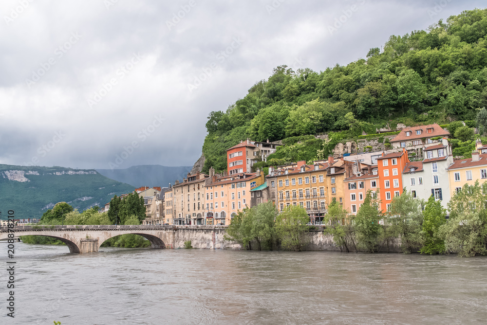 Grenoble, panorama of beautiful typical houses on the river Isere, in the center 
