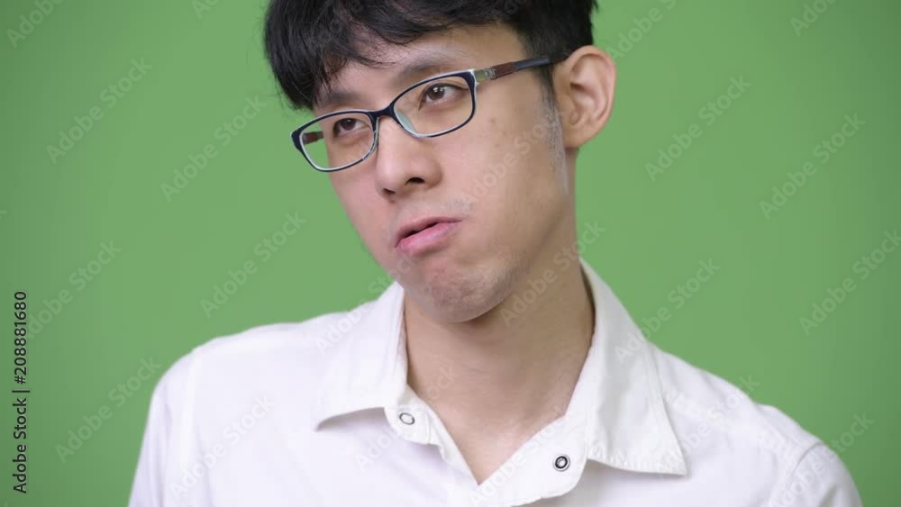 Young Asian businessman feeling bored Young Asian businessman feeling bored